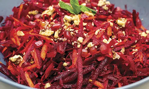 Beet and carrot salad with pomegranate and pumpkin seeds