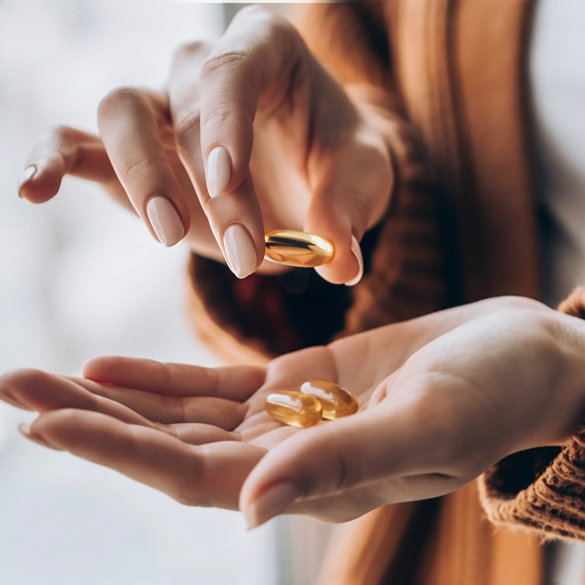 Hands holding pills