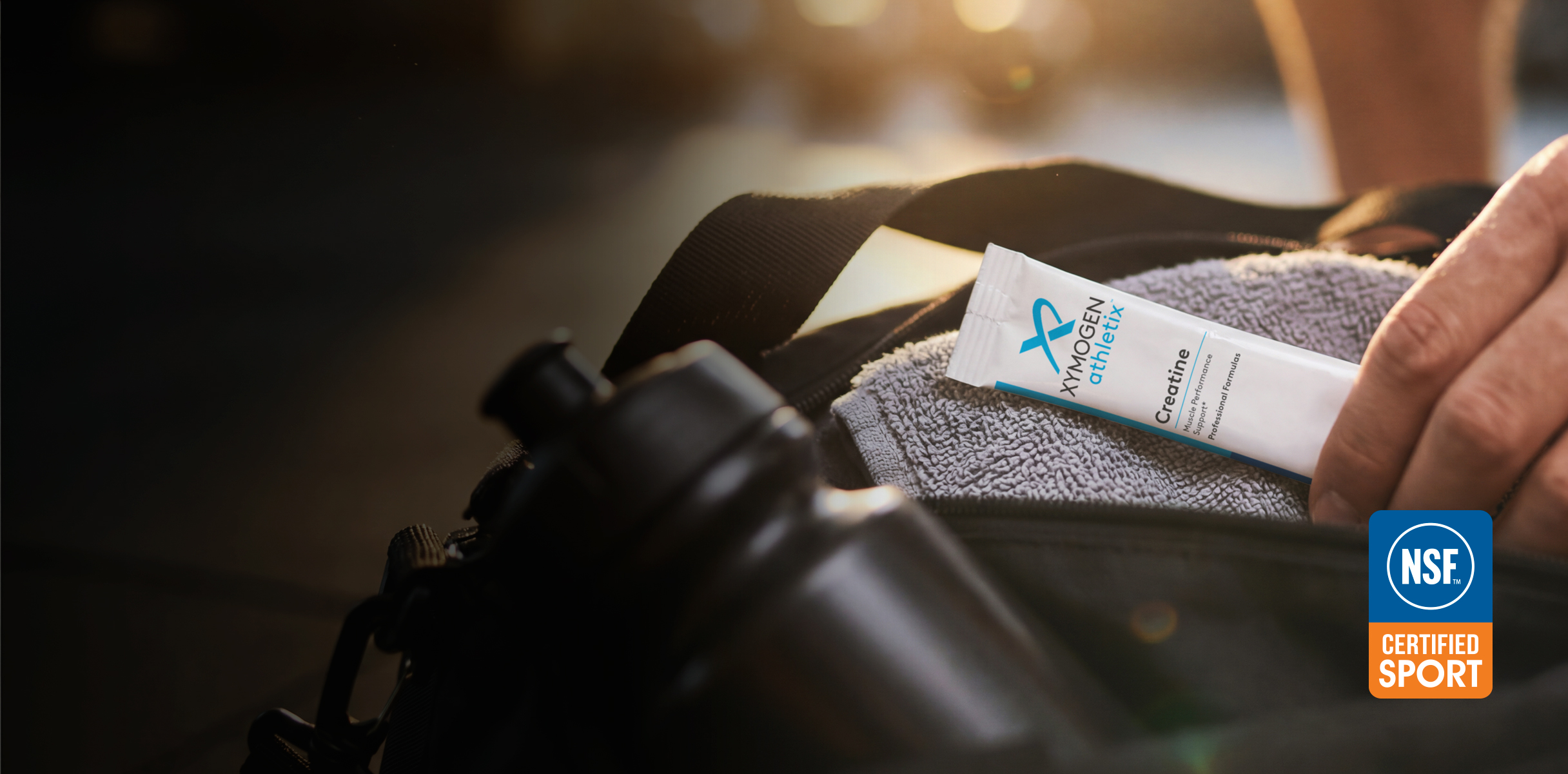 Hand picking a creatine stick pack