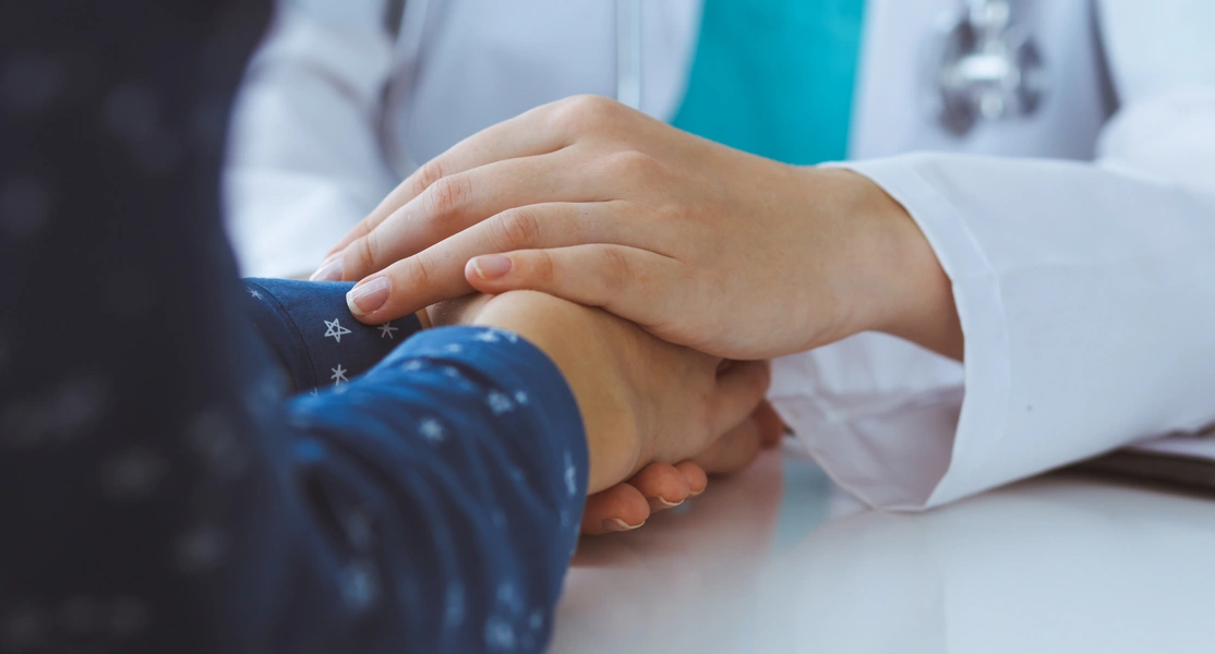 A healthcare 
                                                professional and their patient